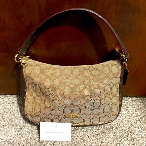 Coach Handbags - Coach Outline Signature jacquard fabric/Leather
Zip Shoulder Handbag EUC